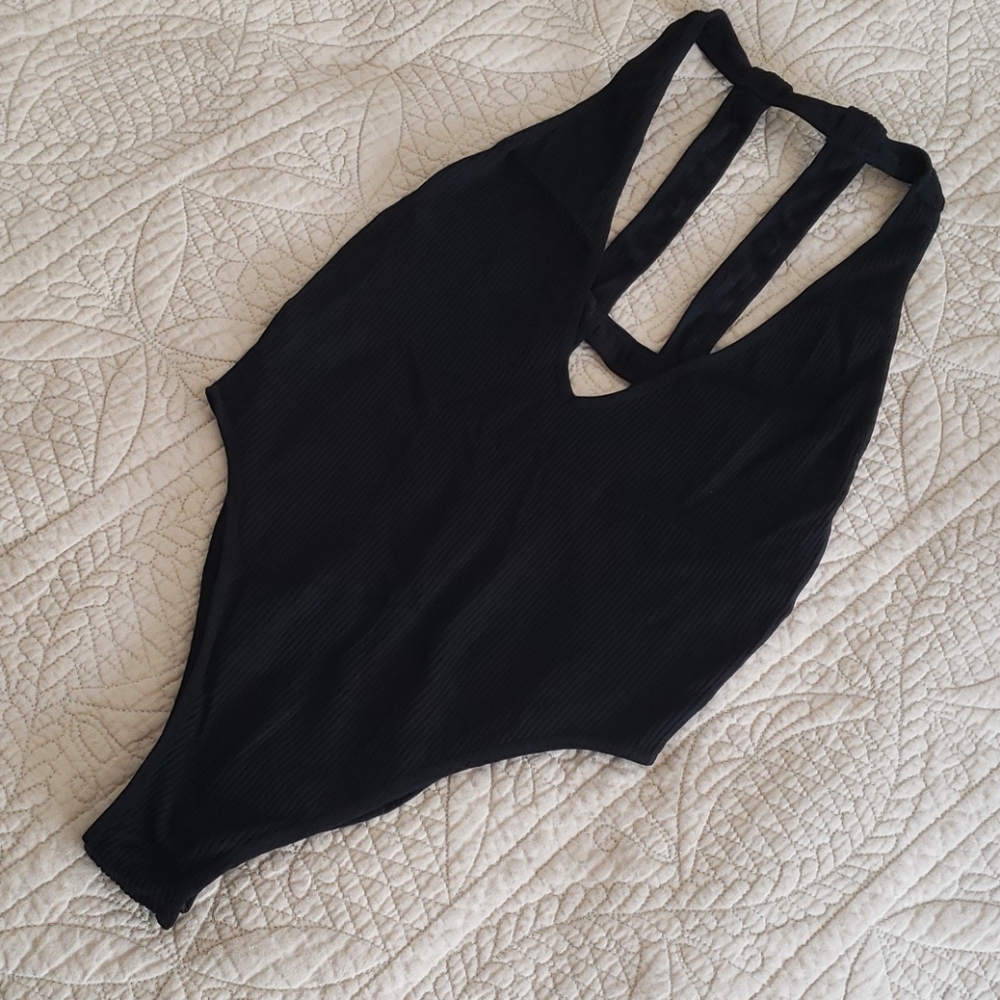 Deep v-neck and strappy back Bodysuit BNWOT